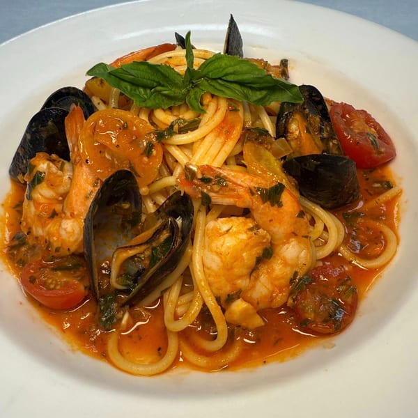 Moroso's spaghetti with shrimp, mussels, cherry tomatoes, and basil in a rich red sauce.